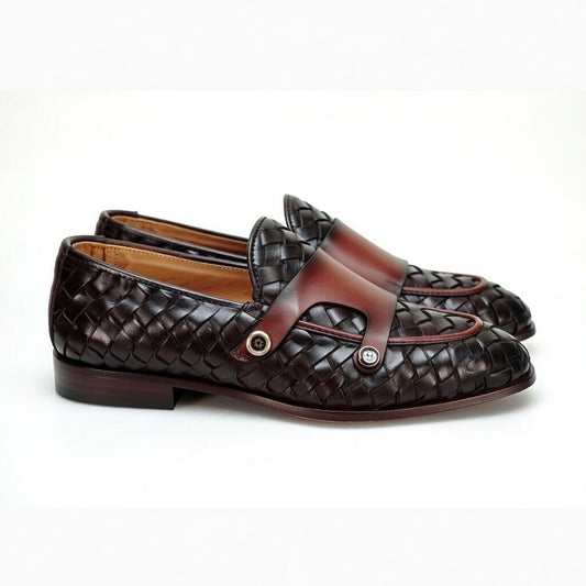 Men’s woven leather loafers with brown strap detail on white background