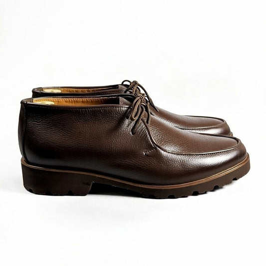 Men’s dark brown leather chukka shoes with lace-up design on white background
