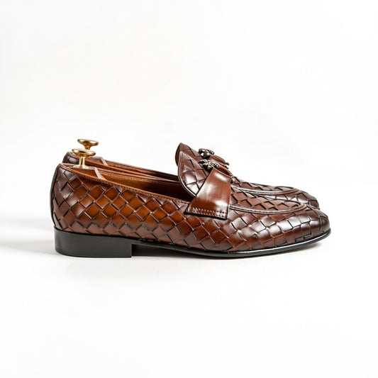 Brown woven loafer shoe on a white background