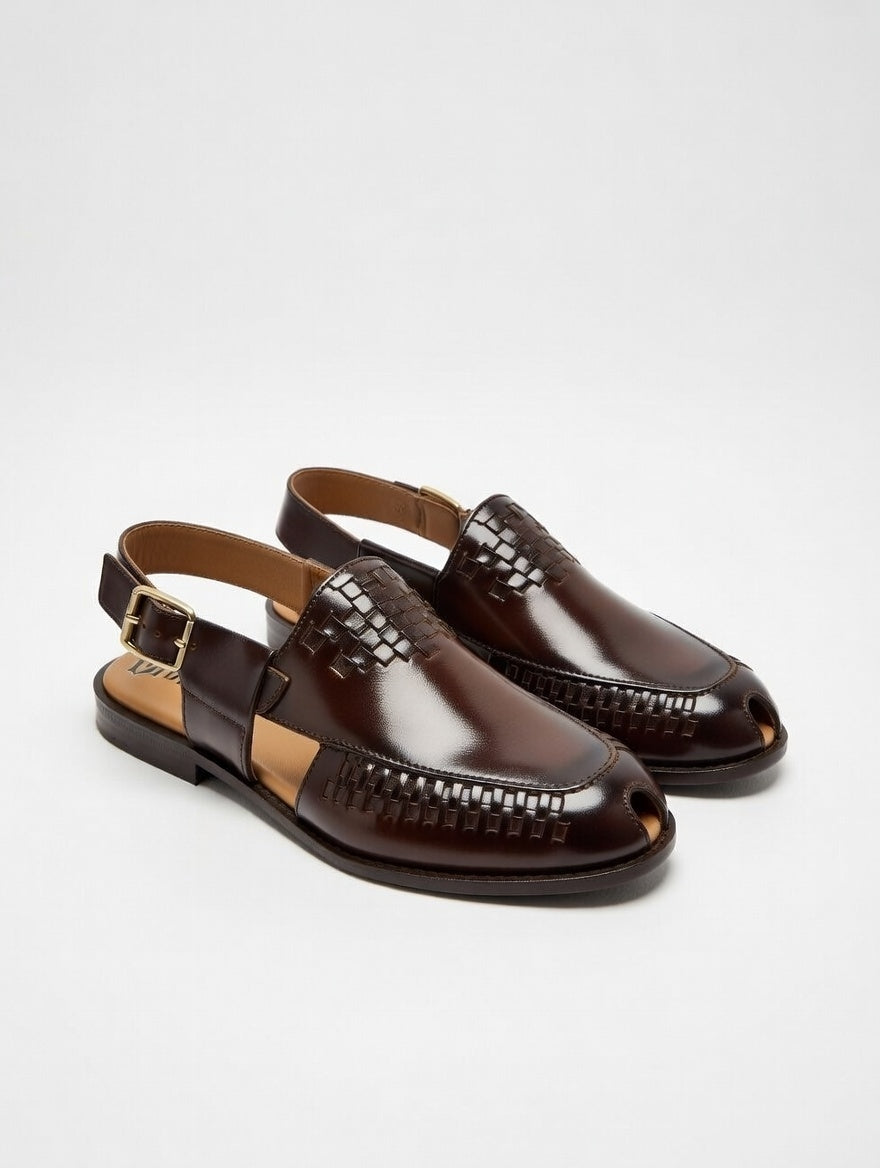 Pair of brown loafers on a light gray background