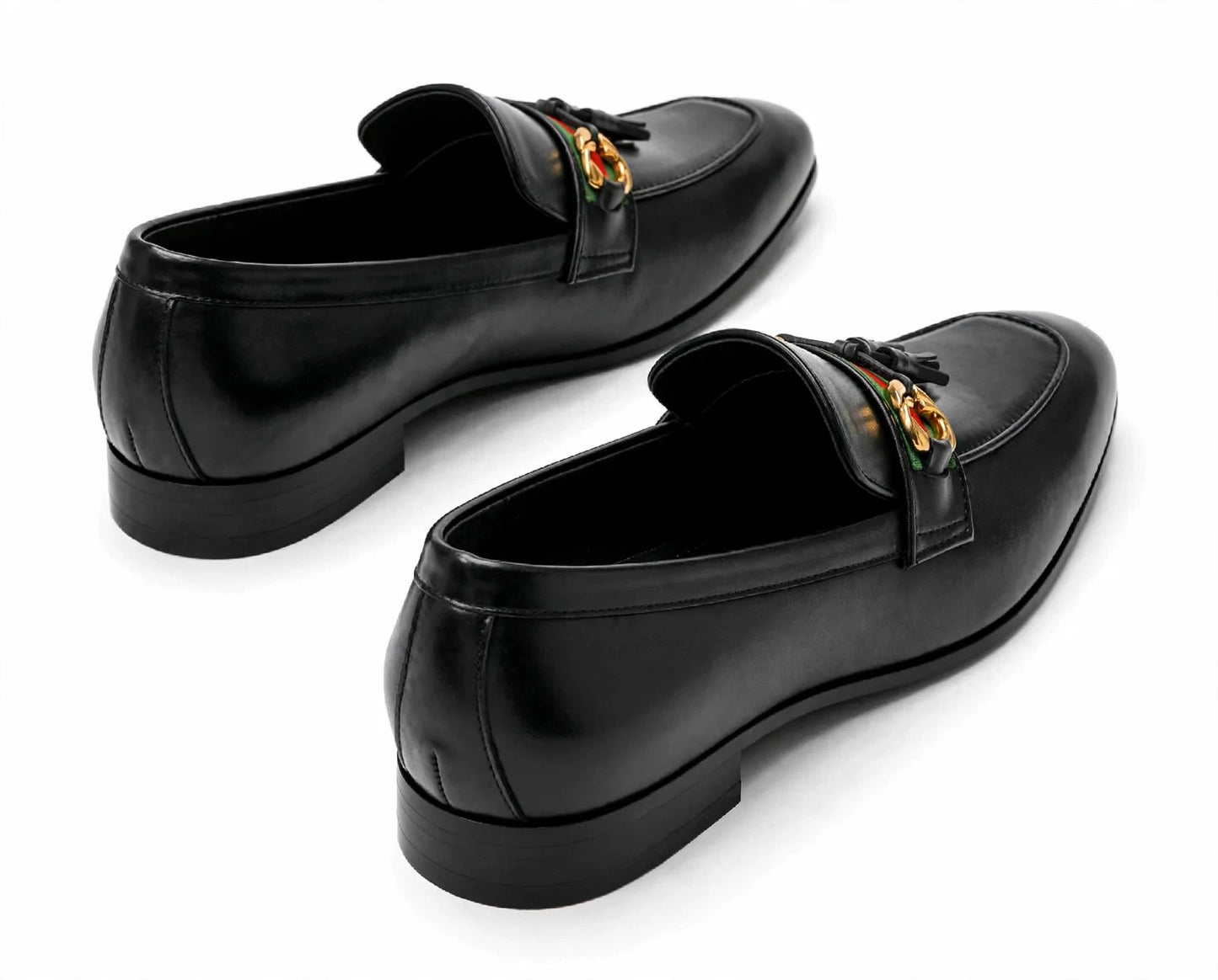 A pair of black leather penny loafers with a gold-tone horsebit detail on the strap, displayed on a clean white background.
