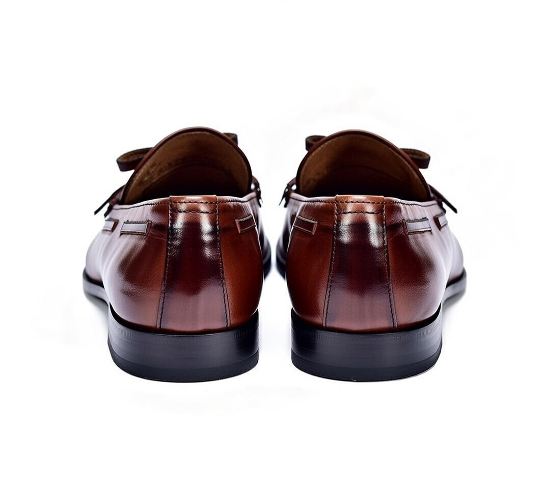 Brown leather dress shoes on a white background