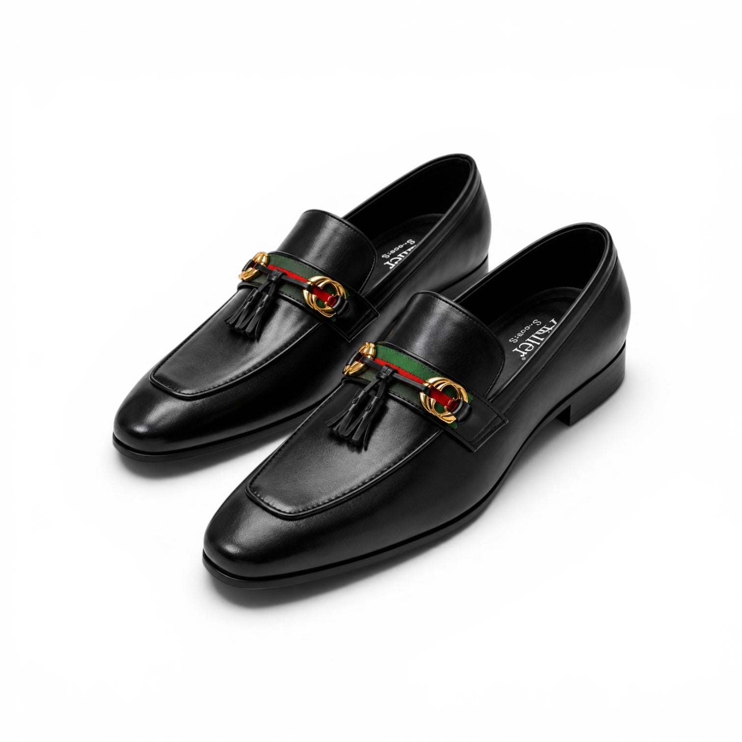 A pair of black leather Gucci tassel loafers with the brand's signature green and red web stripe and gold-tone horsebit hardware, displayed on a clean white background.
