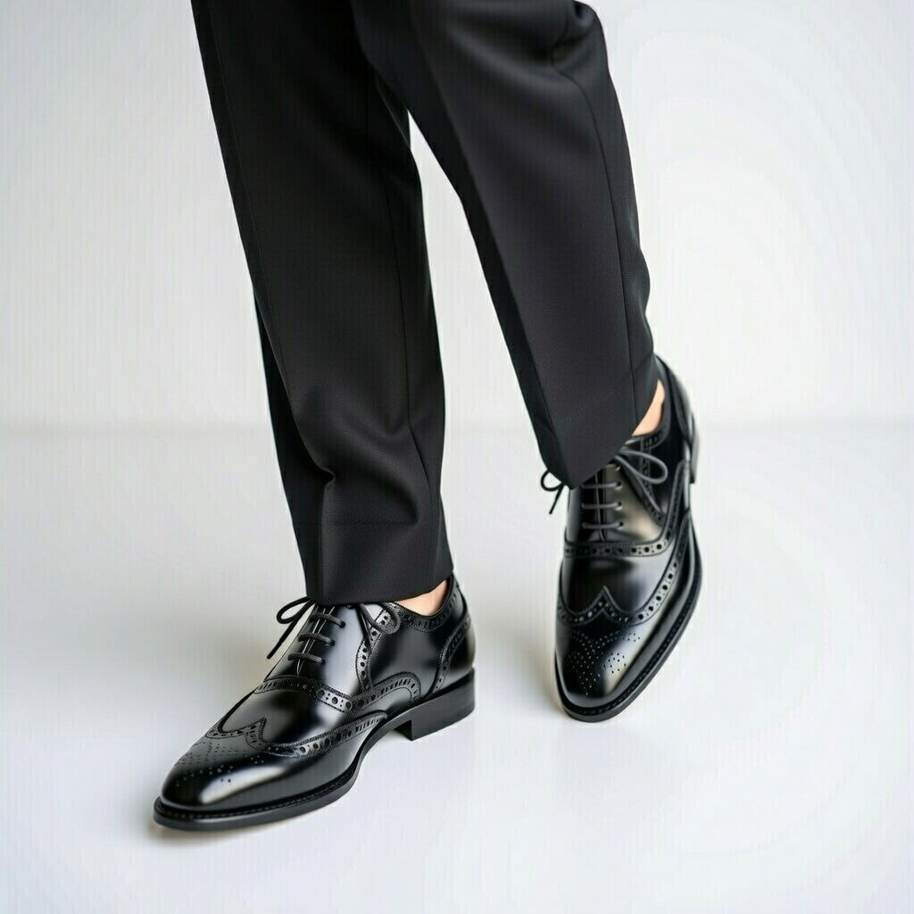 Black dress shoes and pants on a white background