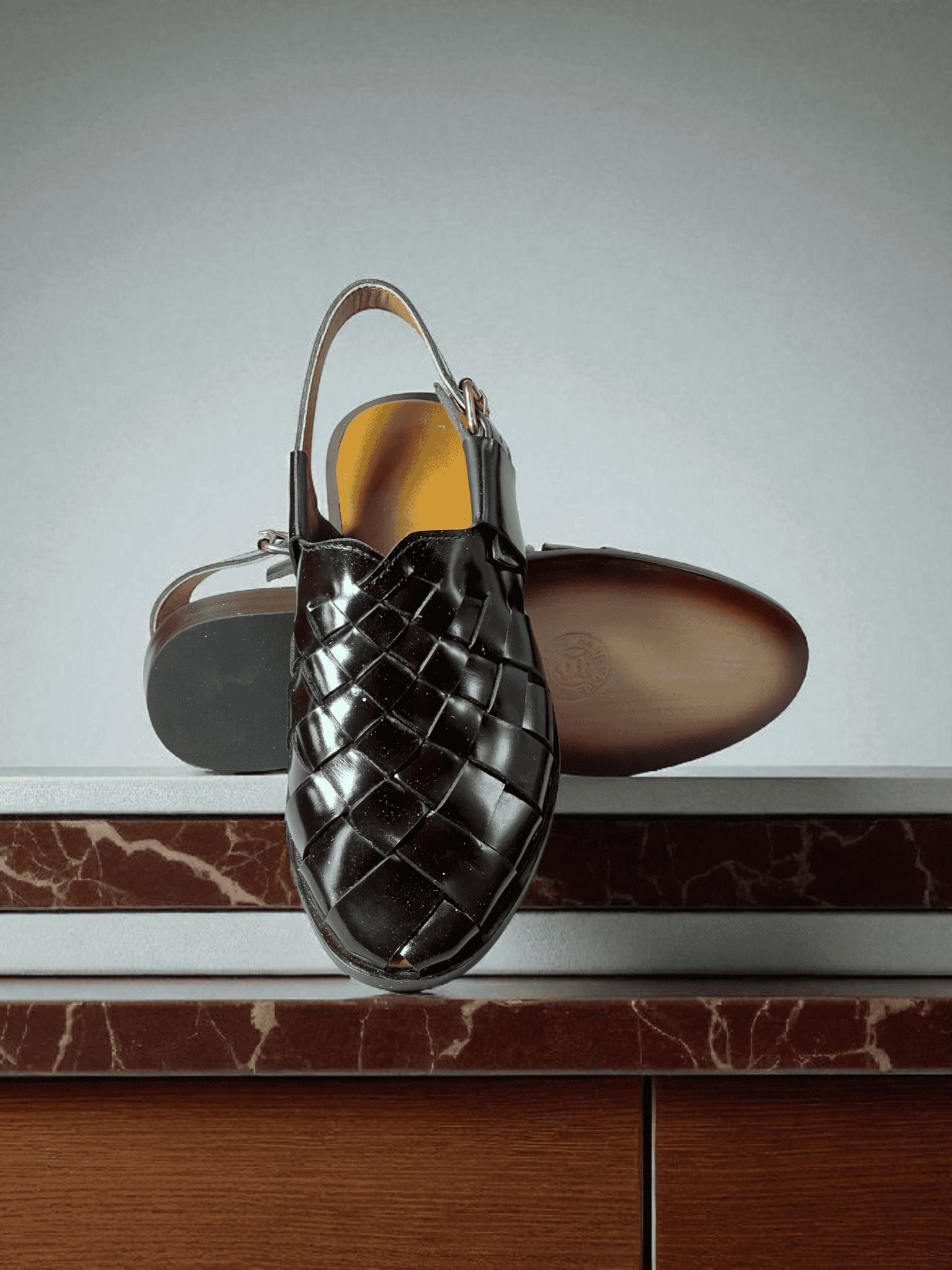 Crafted with care, AS -Noir Classic is a pair of handmade leather woven sandals that exude elegance and comfort. Made with premium materials, these sandals are perfect for any occasion and are sure to elevate your style. Step into luxury with Noir Classic.