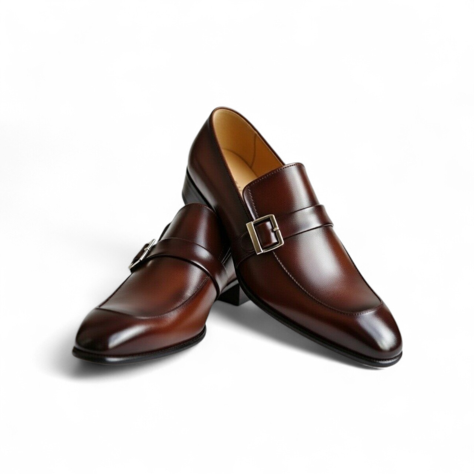 Pair of brown leather shoes with buckles on a white background