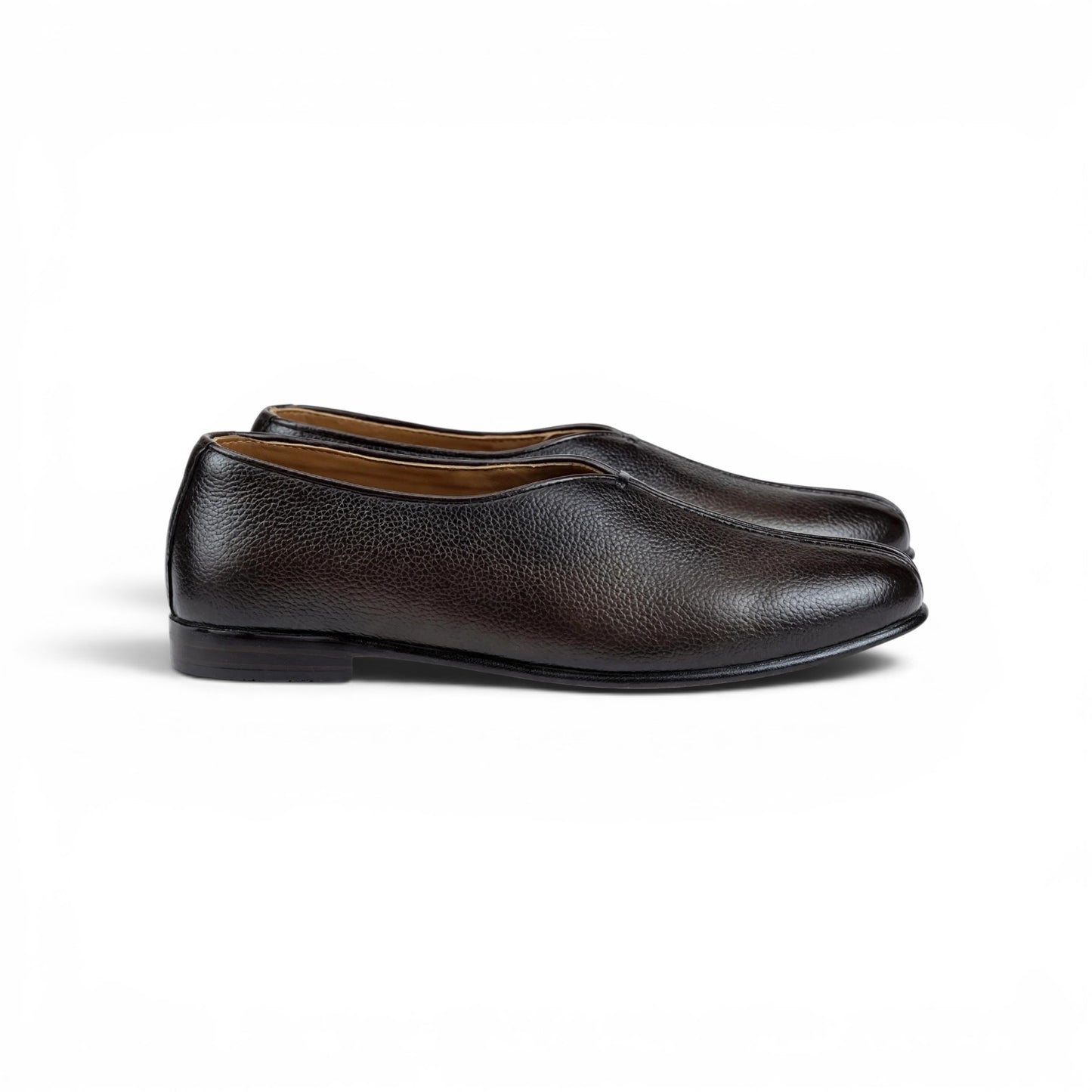 A pair of dark brown leather slip-on loafers with a pebbled texture, shown from a side profile on a clean white background.