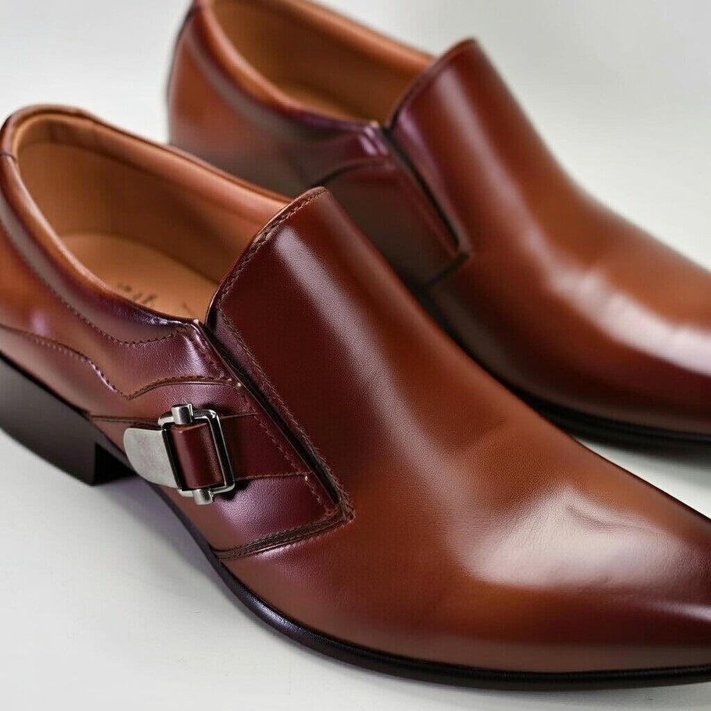 Brown leather shoes with a buckle on a light background
