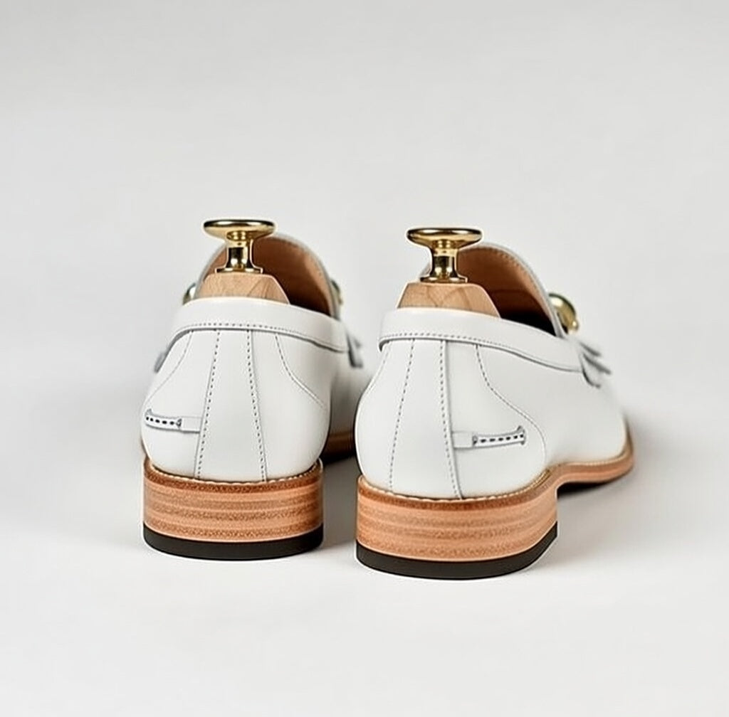 White leather shoes with wooden soles on a white background