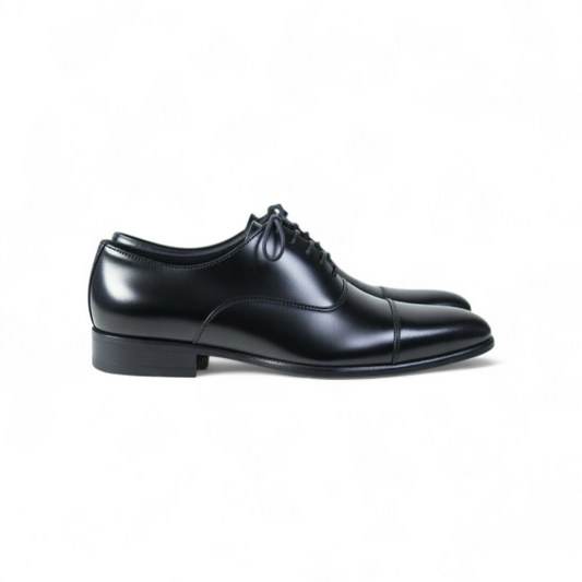 Black dress shoes on a white background