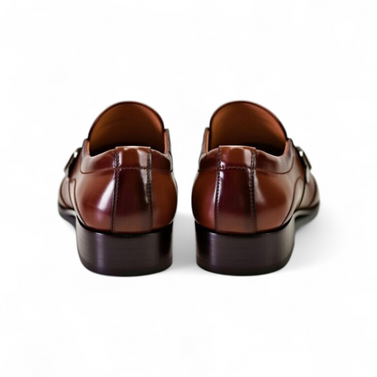 Pair of brown leather shoes on a white background