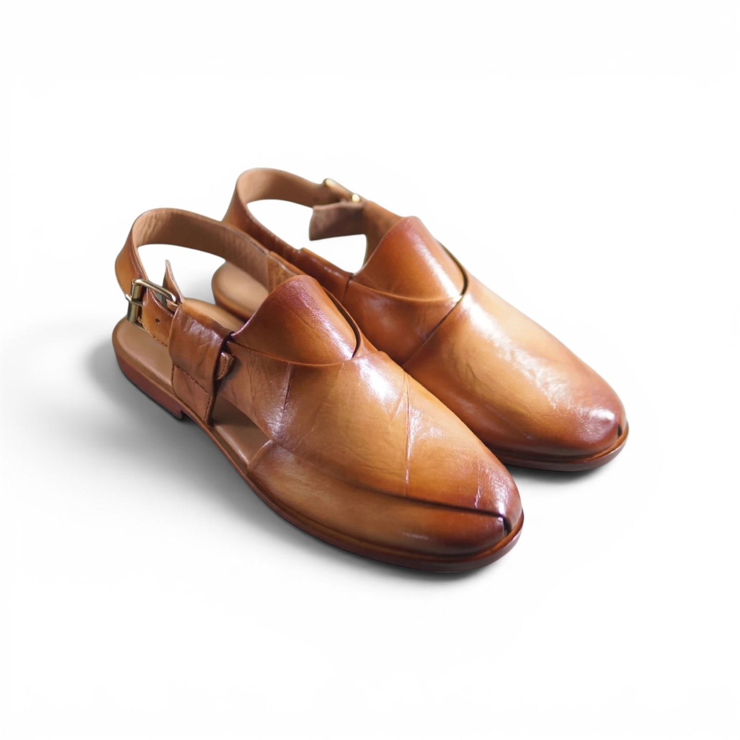 A pair of men's brown leather slip-on shoes with adjustable ankle straps and small metal buckles, photographed on a clean white background.