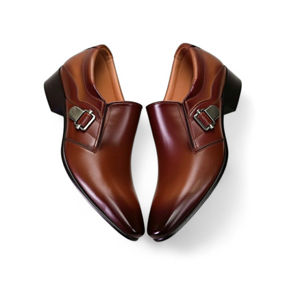 Pair of brown leather shoes with buckles on a white background