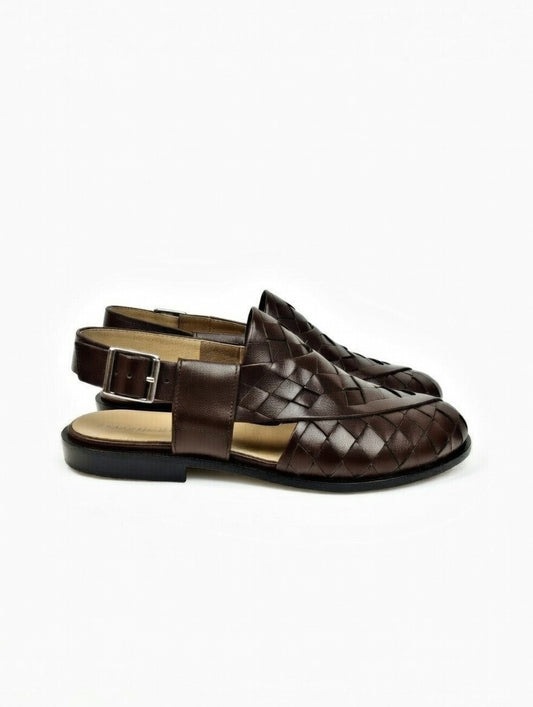 Brown woven sandals on a white background