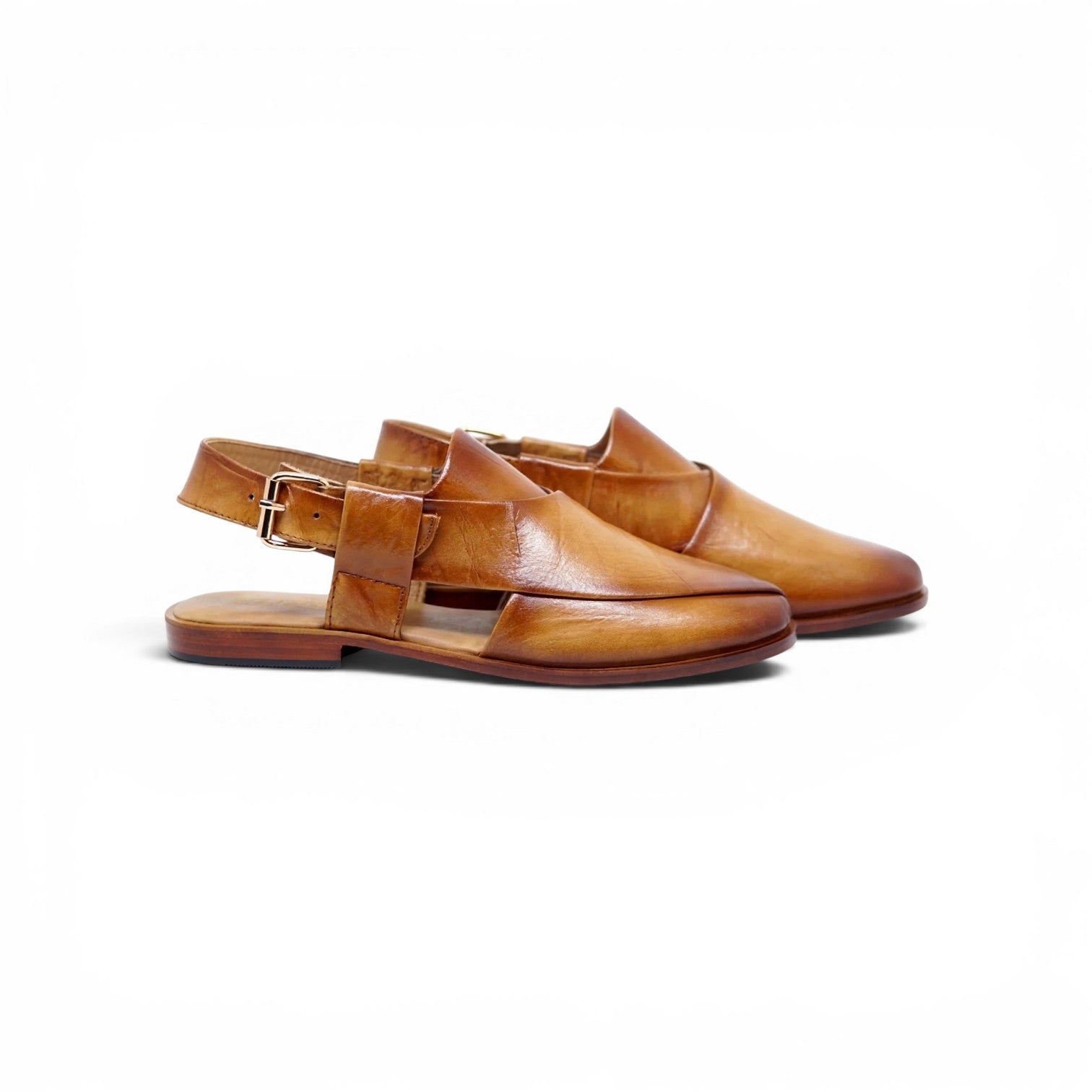A pair of tan leather slingback flat sandals with a buckle strap, displayed on a clean white background.