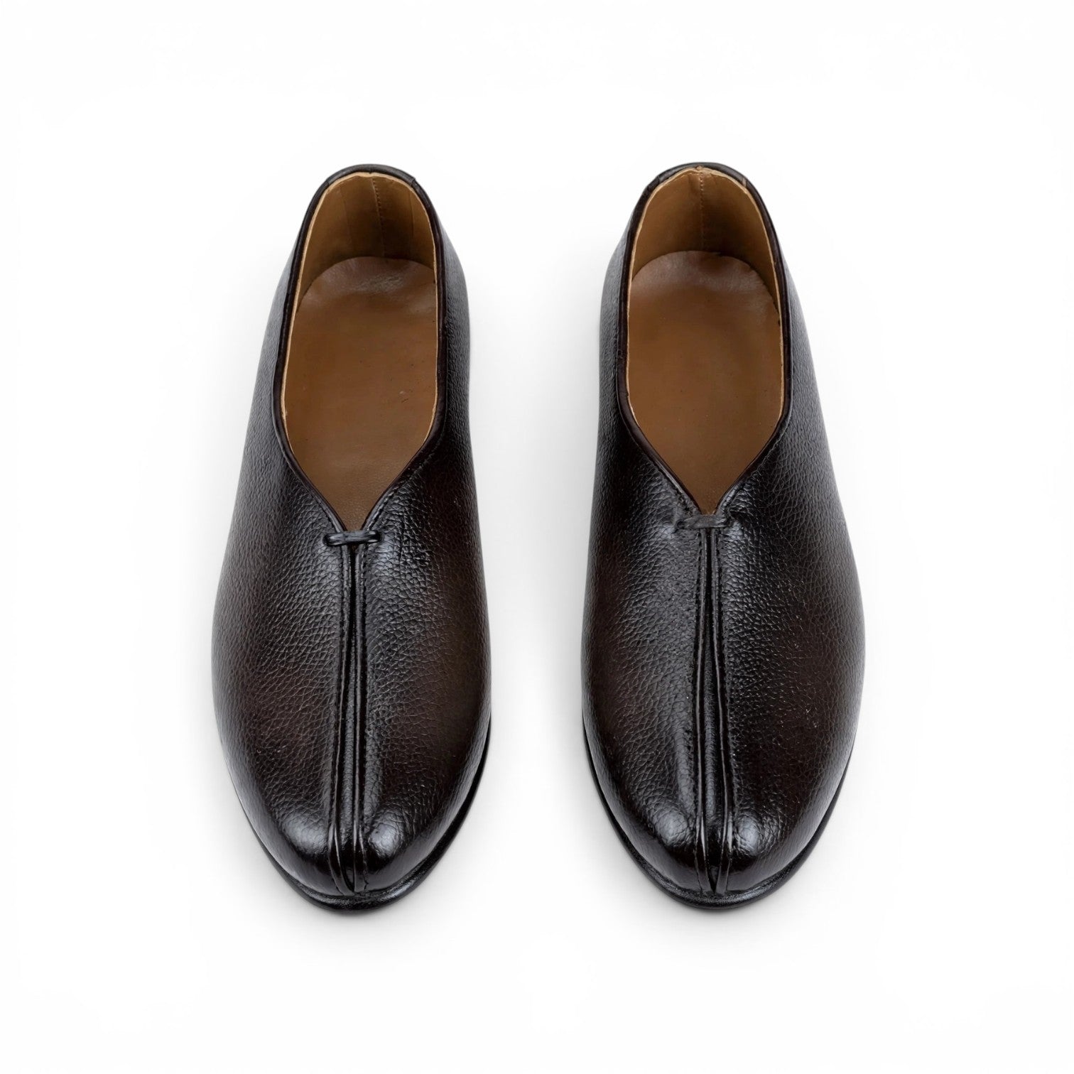 A pair of dark brown leather slip-on shoes with a pebbled texture and a central seam detail, shown from a top-down view on a white background.