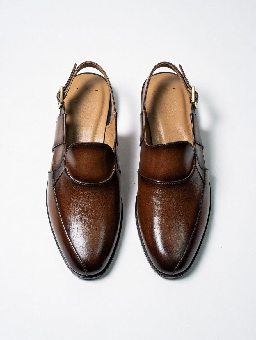 Pair of brown leather shoes on a white background