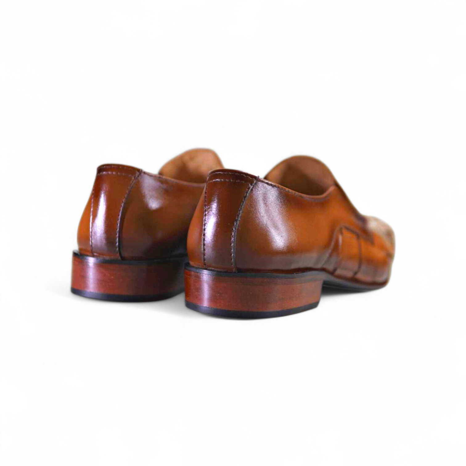 Pair of brown leather shoes on a white background