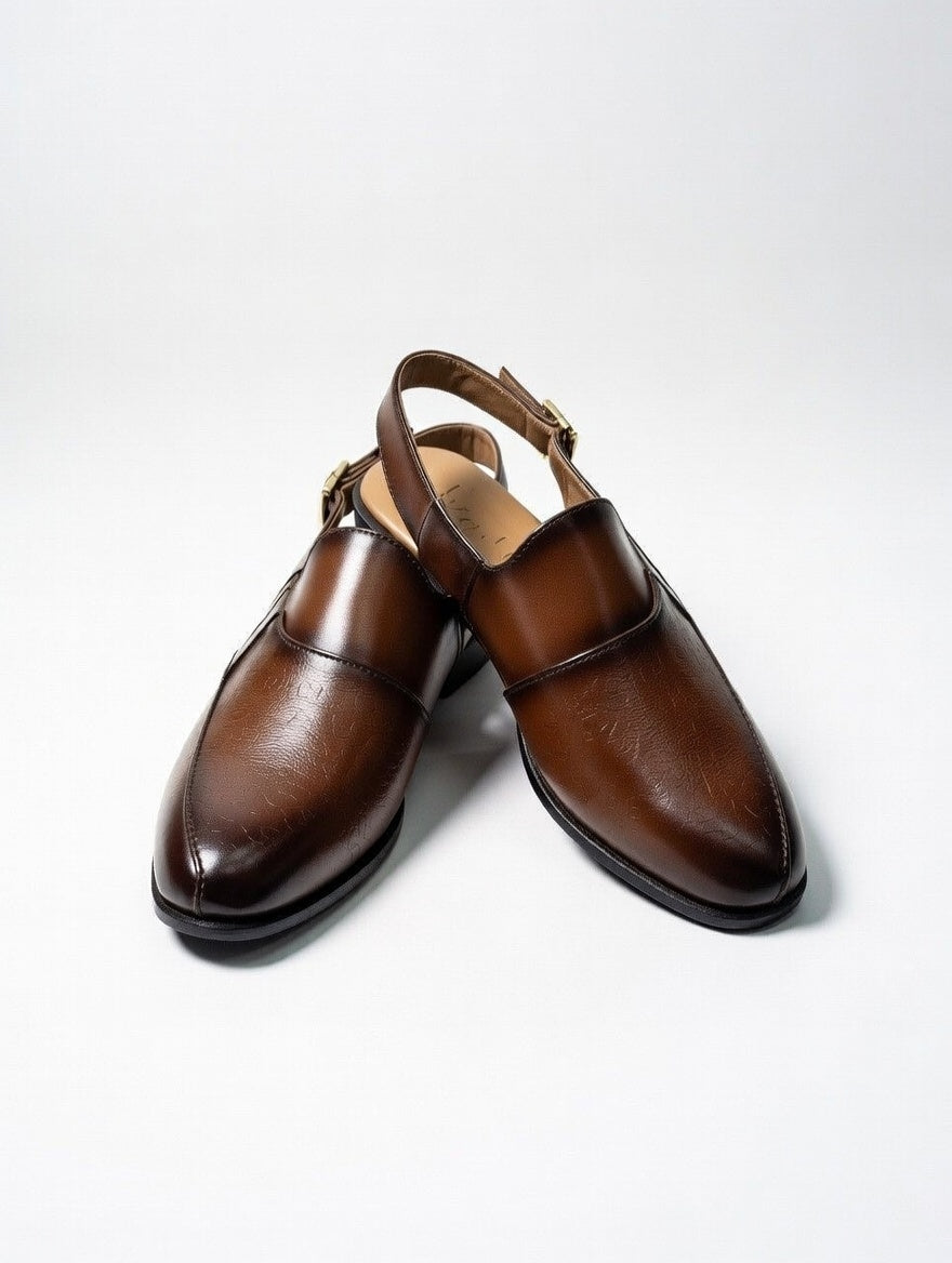 Pair of brown leather shoes on a white background
