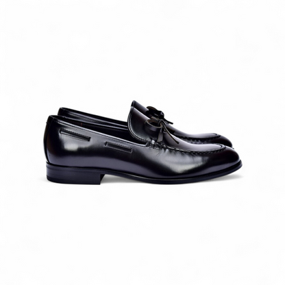 Brown slip-on shoe with 'The North Face' logo on a white background