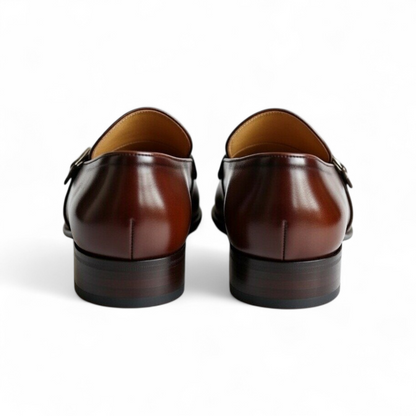 Pair of brown leather shoes on a white background