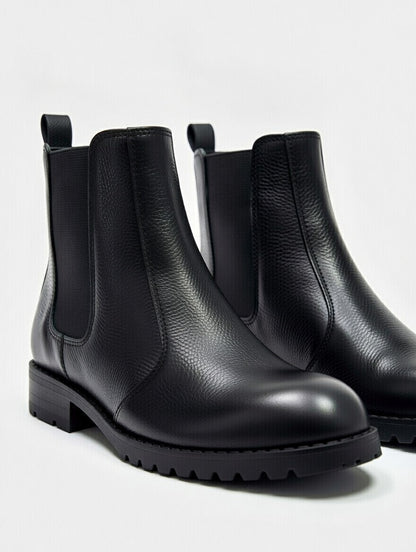 Men’s black leather Chelsea boots with elastic side panels and durable sole