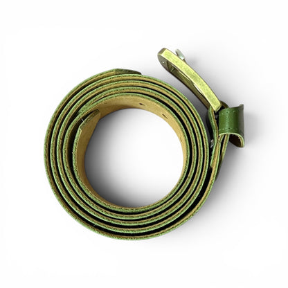An olive green leather belt coiled on a white background, showing its textured exterior and smooth tan interior.