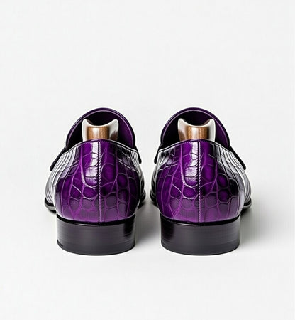 Purple crocodile-patterned shoes on a white background