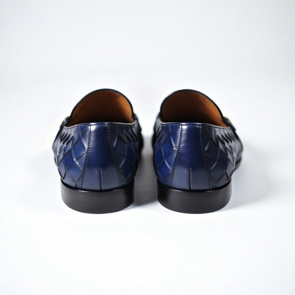 Pair of blue leather shoes on a white background