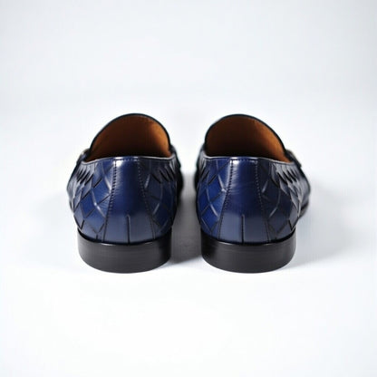 Pair of blue leather shoes on a white background