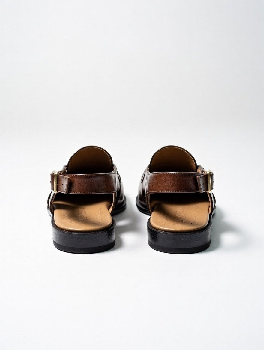 Pair of brown sandals on a white background