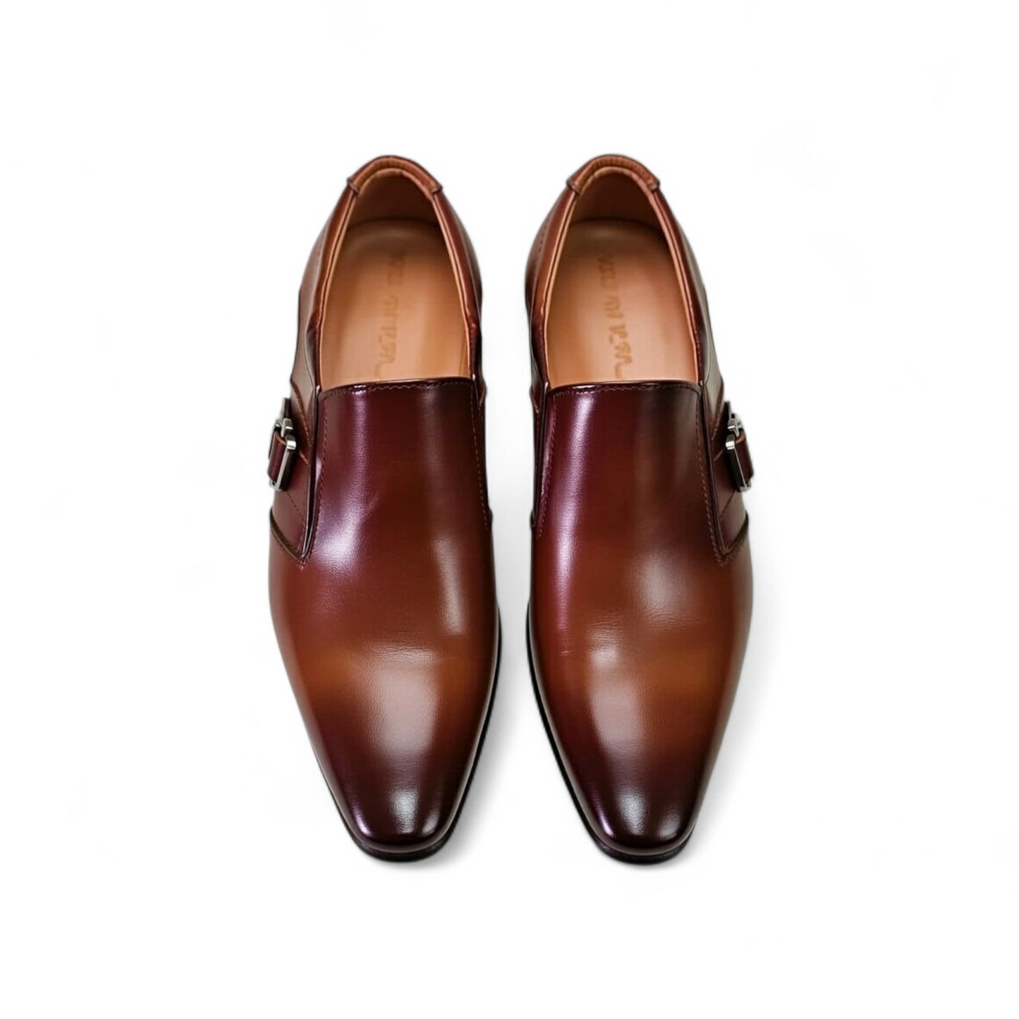 Pair of brown leather dress shoes on a white background