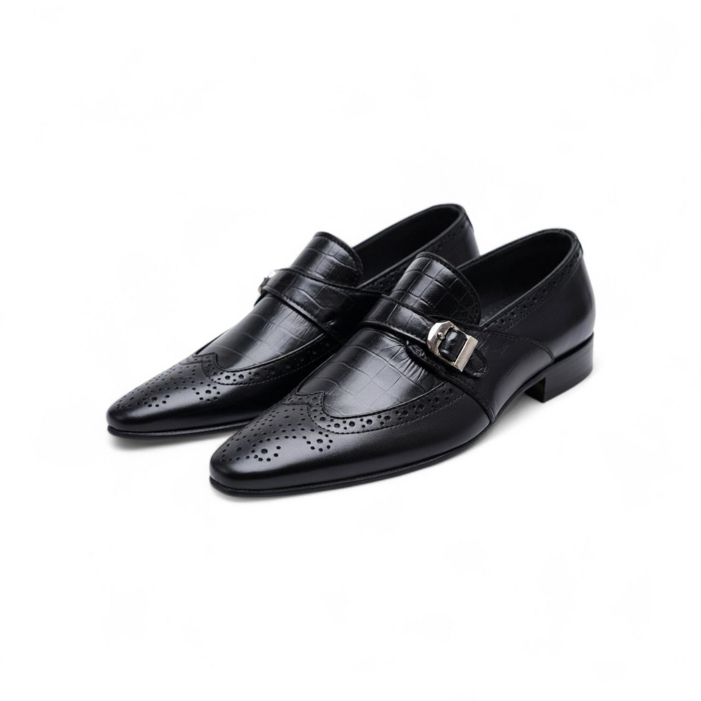 Pair of black leather dress shoes with buckles on a white background
