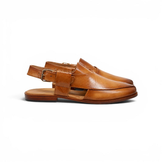 A pair of tan leather slingback mule sandals with a buckle strap and a cutout front, shown from a side profile on a white background.