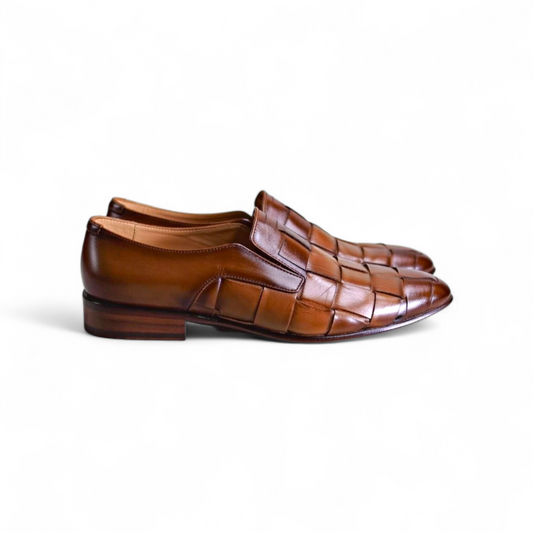 Pair of brown woven dress shoes on a white background