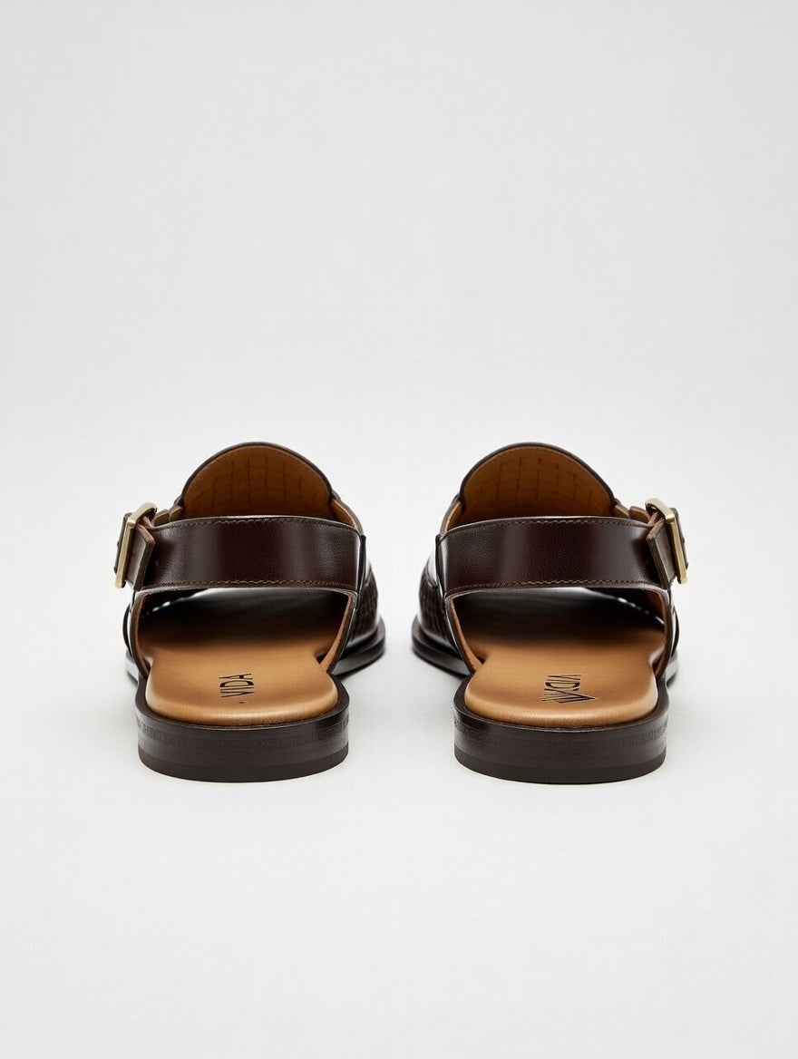 Pair of brown sandals on a white background