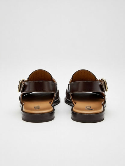 Pair of brown sandals on a white background