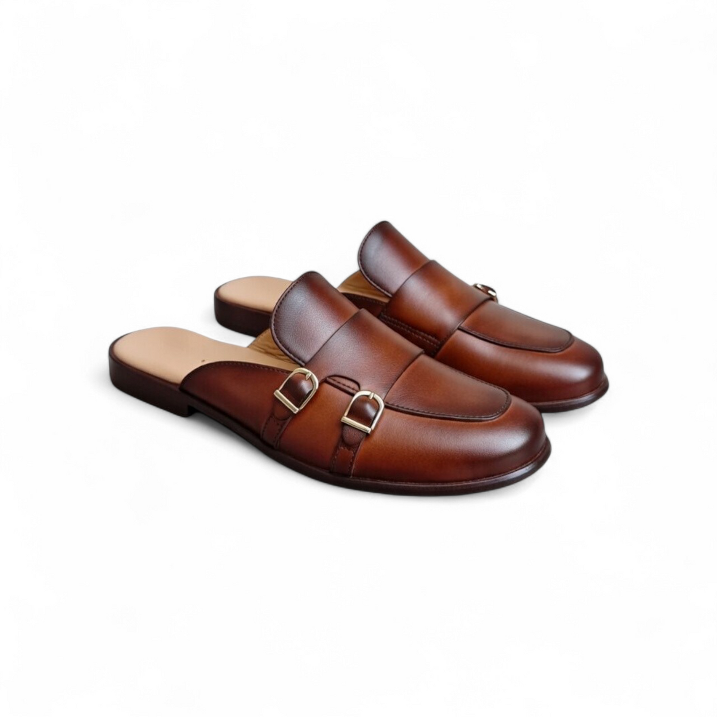 Pair of brown leather shoes with buckles on a white background