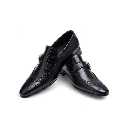 Pair of black dress shoes on a white background