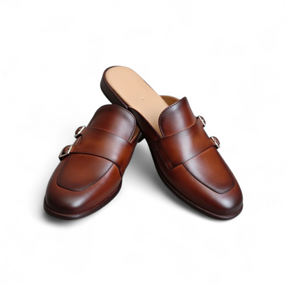 Pair of brown loafers on a white background